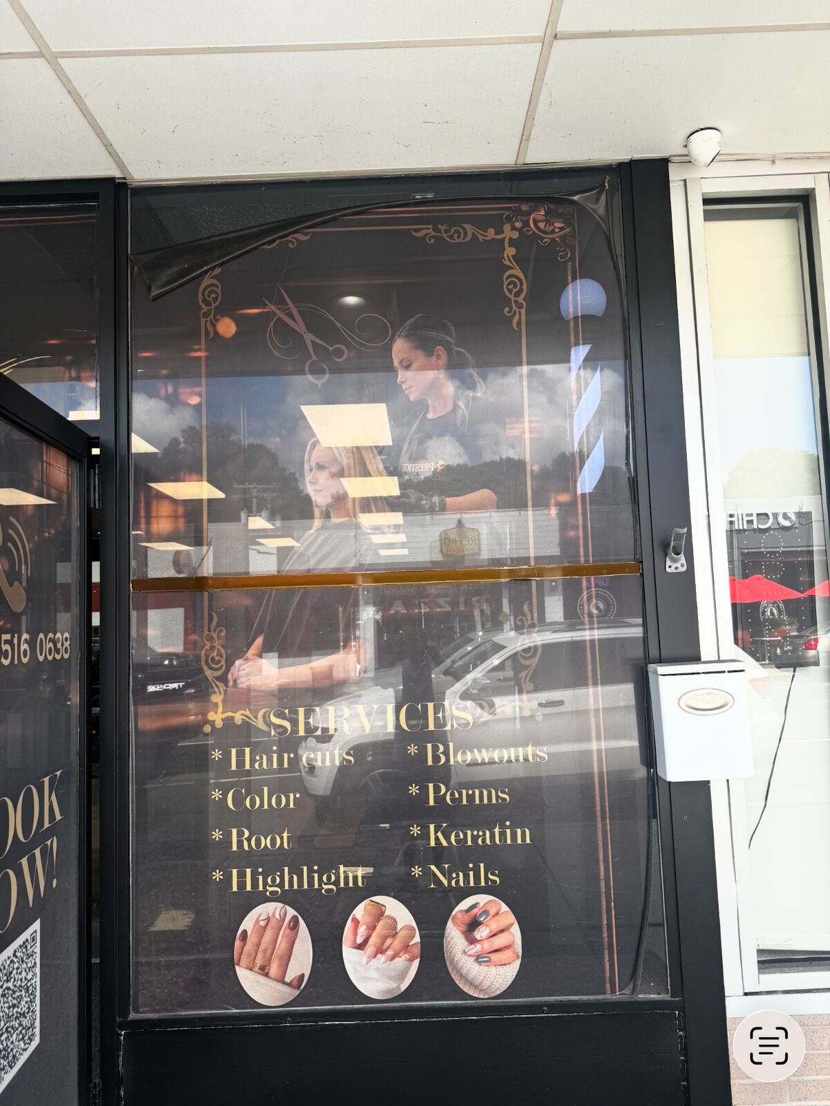 Prestige Barbershop failing original window film lifting away from the glass